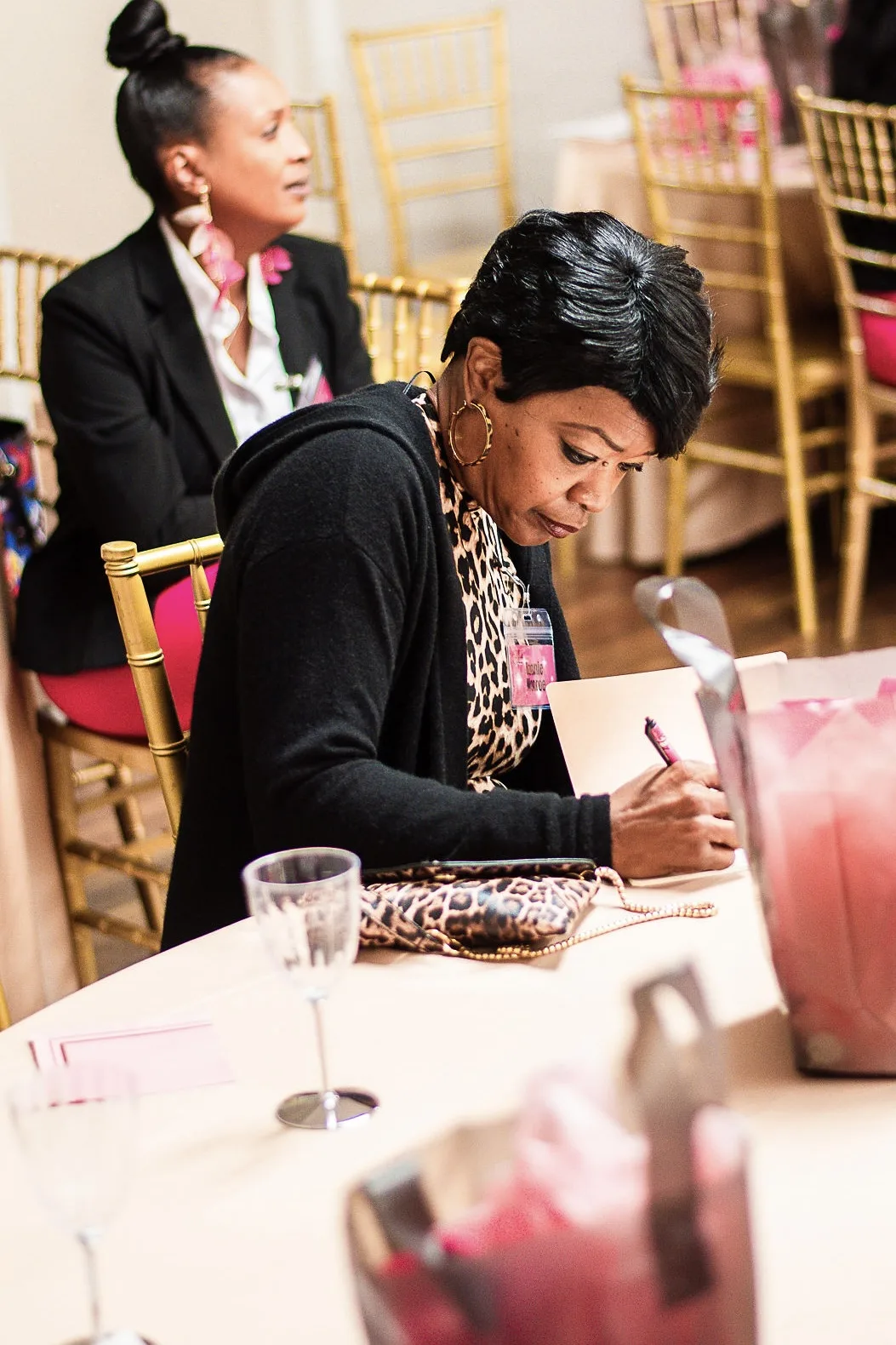 Woman writing and reflecting at GLAM Life 4 God